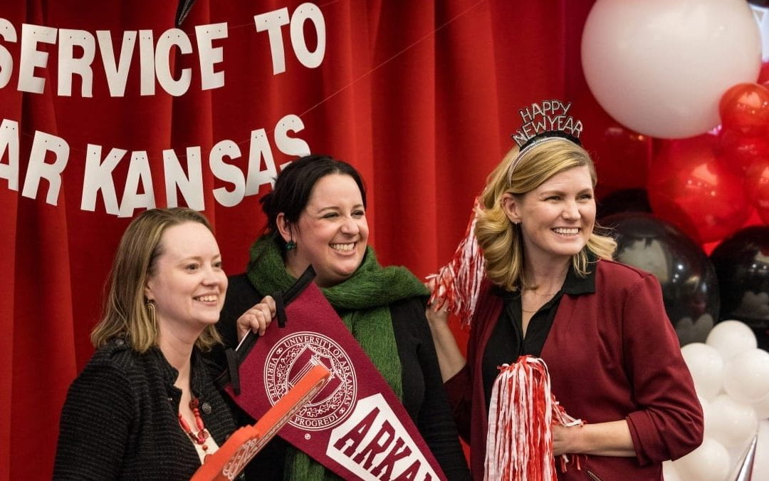 Members of the college's Office of Research and Grant Administration - Kristen Hartung, Kathleen Smoot and Stacy Stuart - pose for a fun photo at the Service to Arkansas Celebration on Dec. 11, 2023.